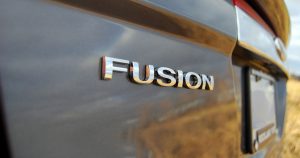 The back end of a 2018 Ford Fusion where the word Fusion is clearly visible. 
