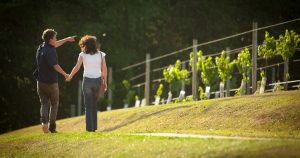 Man and woman walking past winery